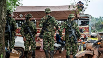 FILE — Dissidents from the Revolutionary Armed Forces of Colombia, known as the FARC, during a meeting with villagers in Yarí, southern Colombia, on April 16, 2023. The four children who survived an almost unfathomable 40 days in the Colombian jungle after their tiny plane crashed in the Amazon rainforest had boarded the plane because they were fleeing for their lives. (Federico Rios/The New York Times)