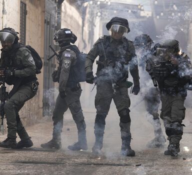 Palestinians shoot fireworks at Israeli police in the Old City of Jerusalem, Sunday, April 17, 2022. Israeli police clashed with Palestinians outside Al-Aqsa Mosque after police cleared Palestinians from the sprawling compound to facilitate the routine visit of Jews to the holy site and accused Palestinians of stockpiling stones in anticipation of violence. (AP Photo/Mahmoud Illean)