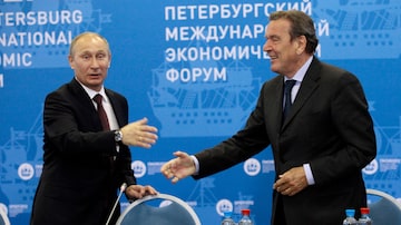 Russian President Vladimir Putin, left, and Germany's former Chancellor Gerhard Schroeder attend an economic forum in St.Petersburg, Russia, Thursday, June 21, 2012. Gerhard Schroeder left the German chancellery after a narrow election defeat in 2005 with an ambitious overhaul of the countryâ€™s welfare state beginning to kick in and every chance of becoming a respected elder statesman. Fast-forward to last week: German lawmakers agreed to shut down Schroederâ€™s taxpayer-funded office, the European Parliament called for him to be sanctioned, and his own party set a mid-June hearing on applications to have him expelled. Schroederâ€™s association with the Russian energy sector turned the 78-year-old into a political pariah in Germany after the invasion of Ukraine. (AP Photo/Dmitry Lovetsky, pool)