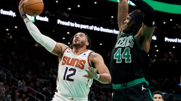 Phoenix Suns' Ish Wainright (12) shoots against Boston Celtics' Robert Williams III (44) during the second half of an NBA basketball game, Friday, Feb. 3, 2023, in Boston. (AP Photo/Michael Dwyer)
