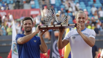 Nicolas Barrientos of Colombia, left, and Rafael Matos of Brazil pose with their trophy after defeating Austrians Alexander Erler and Lucas Miedler during the doubles final match at Rio Open tennis tournament in Rio de Janeiro, Brazil, Sunday, Feb. 25, 2024. (AP Photo/Bruna Prado)