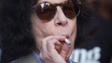 Author Fran Lebowitz smokes as she waits for her car following the Diane von Furstenberg Spring/Summer 2015 collection show during New York Fashion Week in the Manhattan borough of New York September 7, 2014.    REUTERS/Carlo Allegri (UNITED STATES - Tags: FASHION ENTERTAINMENT)