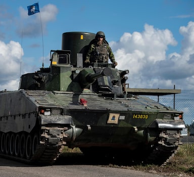 FILE - In this photo provided by the Swedish Armed Forces on Aug. 25, 2020, troops prepare in the Baltic Sea region. The question of whether to join NATO is coming to a head in Finland and Sweden, where Russiaâ€™s invasion of Ukraine has shattered the long-held belief that remaining outside the military alliance was the best way to avoid trouble with their giant neighbor. If Finland and Sweden join the alliance, Russia would find itself completely surrounded by NATO countries in the Baltic Sea and the Arctic â€” two regions that Moscow considers its backyard. (Joel Thungren/Swedish Armed Forces/TT via AP, File)