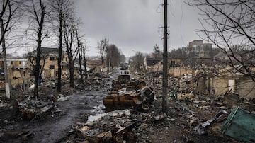  — EMBARGO: NO ELECTRONIC DISTRIBUTION, WEB POSTING OR STREET SALES BEFORE 11 P.M. ET ON DEC. 31, 2022. NO EXCEPTIONS FOR ANY REASONS —   FILE — Damage in the streets of Bucha, Ukraine after Russian soldiers retreated, on April 3, 2022. Hours before Russian troops began withdrawing from the suburban town, a Russian soldier left a trail of blood and devastated lives in a last paroxysm of violence. (Ivor Prickett/The New York Times)