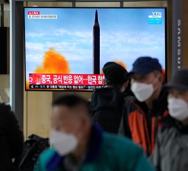 People watch a TV showing a file image of North Korea's missile launch during a news program at the Seoul Railway Station in Seoul, South Korea, Thursday, March 24, 2022. North Korea fired at least one suspected ballistic missile toward the sea Thursday, its neighbors' militaries said, apparently extending its barrage of weapons tests that may culminate with a flight of its biggest-yet intercontinental ballistic missile. (AP Photo/Ahn Young-joon)