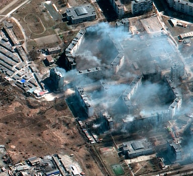 This satellite image provided by Maxar Technologies shows burning apartment building in northeastern Mariupol, Ukraine during the Russian invasion on Saturday, March 19, 2022. (Satellite image Â©2022 Maxar Technologies via AP)