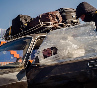 A vehicle arrives at the registration center in Zaporizhzhia, Ukraine, on Saturday. Thousands of people each day flee their homes in Mariupol for safer territory. MUST CREDIT: Photo for The Washington Post by Wojciech Grzedzinski