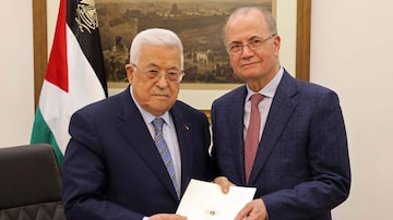 This handout picture provided by the Palestinian Authority's Press Office (PPO) shows Palestinian President Mahmud Abbas (L) posing with the newly appointed Palestinian Prime Minister Mohammad Mustafa, in Ramallah on March 14, 2024. Abbas has appointed Mohammed Mustafa, a long-trusted adviser on economic affairs, as prime minister, the official Wafa news agency said. (Photo by PPO / AFP) / === RESTRICTED TO EDITORIAL USE - MANDATORY CREDIT "AFP PHOTO/HO/PPO" - NO MARKETING NO ADVERTISING CAMPAIGNS - DISTRIBUTED AS A SERVICE TO CLIENTS ===