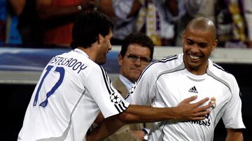 Real Madrid's Ronaldo (R) smiles as he substitutes team mate Ruud van Nistelrooy (L) in front of coach Fabio Capello during their Champions League Group E soccer match against Dynamo Kiev in Madrid September 26, 2006.  REUTERS/Sergio Perez  (SPAIN)