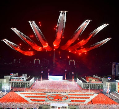 Planes perform an aerial display during a nighttime military parade to mark the 90th anniversary of the founding of the Korean People's Revolutionary Army in Pyongyang, North Korea, in this undated photo released by North Korea's Korean Central News Agency (KCNA) on April 26, 2022. KCNA via REUTERS   ATTENTION EDITORS - THIS IMAGE WAS PROVIDED BY A THIRD PARTY. REUTERS IS UNABLE TO INDEPENDENTLY VERIFY THIS IMAGE. NO THIRD PARTY SALES. SOUTH KOREA OUT. NO COMMERCIAL OR EDITORIAL SALES IN SOUTH KOREA.     TPX IMAGES OF THE DAY