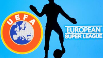 FILE PHOTO: A metal figure of a football player with a ball is seen in front of the words "European Super League" and the UEFA logo in this illustration taken April 20, 2021. REUTERS/Dado Ruvic/Illustration/File Photo