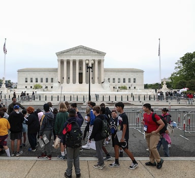 WASHINGTON, DC - MAY 04: A student tour group stops to look at the U.S. Supreme Court Building on May 04, 2022 in Washington, DC. Demonstrations across the country continue as abortion and anti-abortion advocates react to the leaked initial draft majority opinion which indicated the U.S. Supreme Court would overturn two abortion related cases, which would end federal protection of abortion rights.   Anna Moneymaker/Getty Images/AFP
== FOR NEWSPAPERS, INTERNET, TELCOS & TELEVISION USE ONLY ==