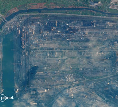 This handout satellite photo released on May 6, 2022, by Planet Labs PBC, shows the Azovstal steel plant in Mariupol, on the Sea of Azov, on May 4, 2022. - Ukraine said a fresh UN-led rescue mission was under way on May 6, 2022, to evacuate the last civilians still trapped inside the besieged steel plant in Mariupol that has become the southern city's final holdout against Russian forces. About 200 civilians, including children, are estimated to remain in hiding in the Soviet-era tunnels and bunkers beneath the sprawling Azovstal factory, along with hundreds of Ukrainian soldiers. (Photo by Planet Labs PBC / AFP) / RESTRICTED TO EDITORIAL USE - MANDATORY CREDIT "AFP PHOTO / Planet Labs PBC " - NO MARKETING - NO ADVERTISING CAMPAIGNS - DISTRIBUTED AS A SERVICE TO CLIENTS