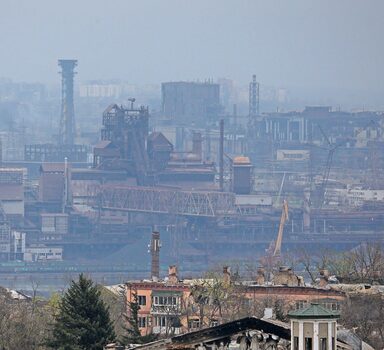 A view shows a plant of Azovstal Iron and Steel Works company behind buildings damaged in the course of Ukraine-Russia conflict in the southern port city of Mariupol, Ukraine April 19, 2022. REUTERS/