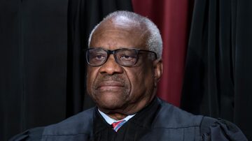 FILE - Associate Justice Clarence Thomas joins other members of the Supreme Court as they pose for a new group portrait, at the Supreme Court building in Washington, Oct. 7, 2022. Conservative mega-donor Harlan Crow purchased three properties belonging to Thomas and his family, in a transaction worth more than $100,000 that Thomas never reported, according to the non-profit investigative journalism organization ProPublica on Thursday, April 13, 2023. (AP Photo/J. Scott Applewhite, File)