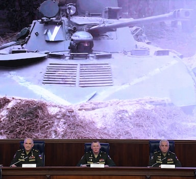 (L-R) Sergei Rudskoi, a senior representative of the General Staff, Defence Ministry spokesman Igor Konashenkov and Mikhail Mizintsev, head of the Russian National Defence Control Centre, hold a briefing on Russian military action in Ukraine, in Moscow on March 25, 2022. - The Russian army on March 25 updated its losses in Ukraine to 1,351 soldiers, while saying that it had evacuated more than 400,000 civilians and condemning Western supplies of weapons to Kyiv. (Photo by NATALIA KOLESNIKOVA / AFP)