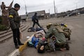 Tragédia de família na Ucrânia, imortalizada em foto, resume massacre do Exército russo 