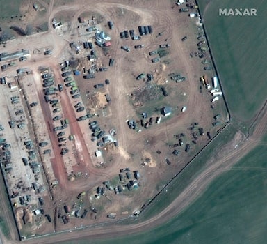 This satellite image provided by Maxar Technologies shows an overview of Kherson airbase with multiple deployment areas and equipment in revetments in Kherson, Ukraine, on April 7, 2022. Some of the vehicles have the â€œZâ€ maneuver marking on them. (Satellite image Â©2022 Maxar Technologies via AP)