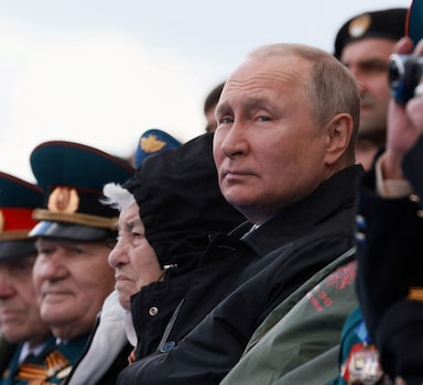 Russian President Vladimir Putin watches a military parade on Victory Day, which marks the 77th anniversary of the victory over Nazi Germany in World War Two, in Red Square in central Moscow, Russia May 9, 2022. Sputnik/Mikhail Metzel/Pool via REUTERS ATTENTION EDITORS - THIS IMAGE WAS PROVIDED BY A THIRD PARTY.     TPX IMAGES OF THE DAY