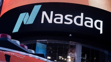 FILE PHOTO: The Nasdaq logo is displayed at the Nasdaq Market site in Times Square in New York City, U.S., December 3, 2021. REUTERS/Jeenah Moon/File Photo/File Photo