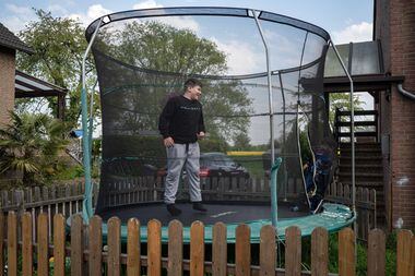 Alex Ebert plays in a trampoline with his younger brother Leon.