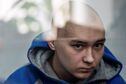 Russian soldier Vadim Shishimarin, 21, suspected of violations of the laws and norms of war, sits inside a defendants' cage during a court hearing, amid Russia's invasion of Ukraine, in Kyiv, Ukraine May 13, 2022. REUTERS/Viacheslav Ratynskyi