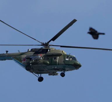A MI-8 military helicopter flies during a rehearsal for the Victory Day military parade which will take place at Dvortsovaya (Palace) Square on May 9 to celebrate 77 years after the victory in World War II in St. Petersburg, Russia, Thursday, April 28, 2022. (AP Photo/Dmitri Lovetsky)