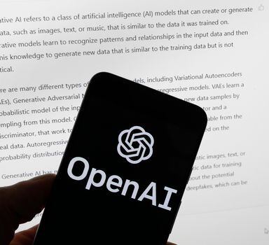 FILE - The OpenAI logo is seen on a mobile phone in front of a computer screen displaying output from ChatGPT, on March 21, 2023, in Boston.  European lawmakers have rushed to add language on general artificial intelligence systems like ChatGPT as they put the finishing touches on the Western world's first AI rules. (AP Photo/Michael Dwyer, File)