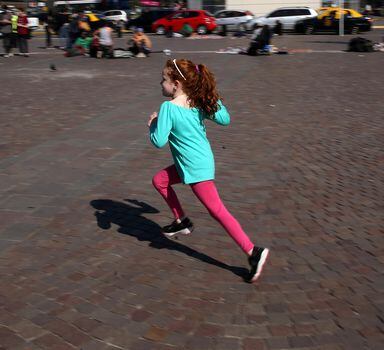 A girl with red hair runs during a gathering to celebrate World Redhead Day in Buenos Aires, Argentina, September 10, 2016. REUTERS/Marcos Brindicci