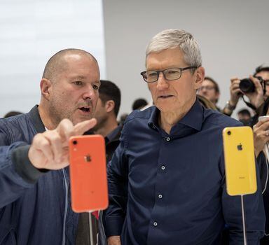 Jony Ive, chief design officer for Apple, left, and Tim Cook, chief executive officer, view a new iPhone during Apple's annual product event. MUST CREDIT: Bloomberg photo by David Paul Morris