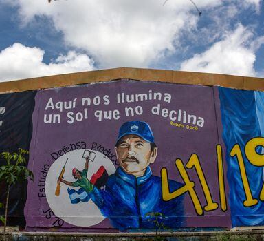 FILE Ñ A mural depicting president Daniel Ortega in Estel’, Nicaragua, on July 2, 2021. The slogan at top is a quotation from the 19th century Nicaraguan poet RubŽn Dario and reads ÒHere we are illuminated by a sun that does not decline.Ó (Inti Ocon/The New York Times)